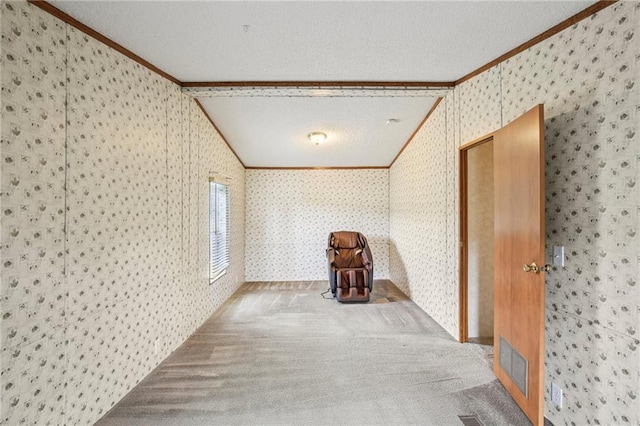 507 NW 165th Rd, Centerview, MO 64019 - carpeted empty room featuring crown molding, wallpapered walls, lofted ceiling, and a textured ceiling