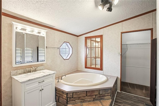 507 NW 165th Rd, Centerview, MO 64019 - full bath with a bath, ornamental molding, vanity, vaulted ceiling, and a textured ceiling