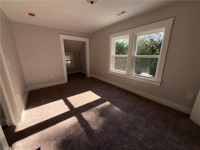 1114 N Liberty St, Independence, MO 64050 - unfurnished room featuring carpet flooring and baseboards