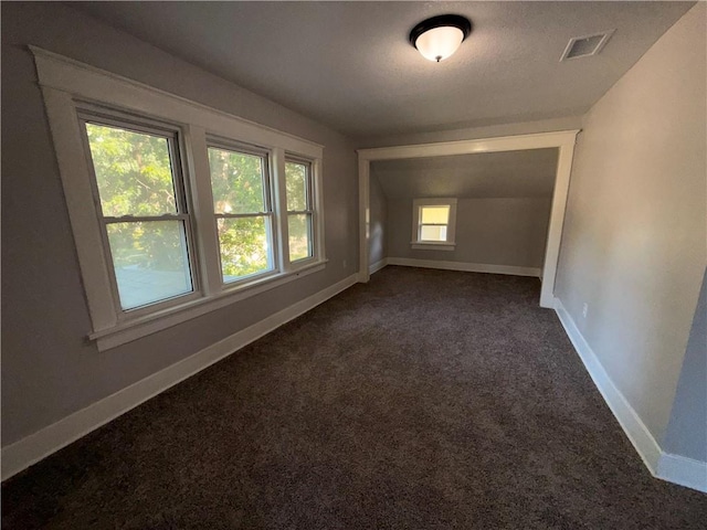 1114 N Liberty St, Independence, MO 64050 - empty room featuring dark carpet and baseboards