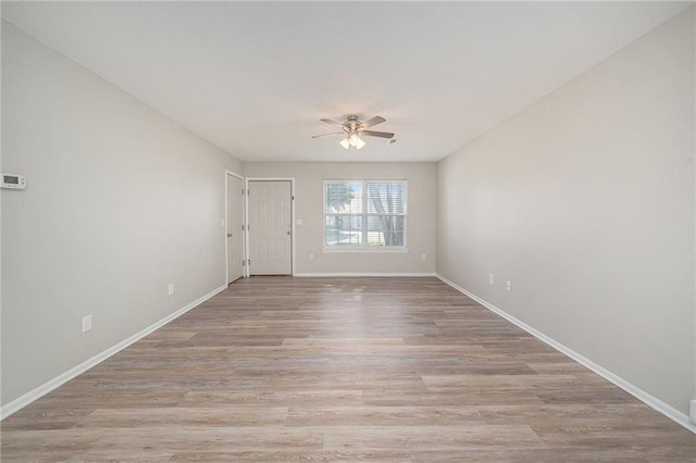 212 NW Parker Dr, Grain Valley, MO 64029 - empty room featuring ceiling fan and light wood-style flooring
