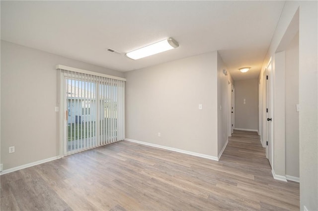 212 NW Parker Dr, Grain Valley, MO 64029 - spare room with light wood finished floors and baseboards