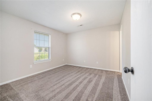 212 NW Parker Dr, Grain Valley, MO 64029 - carpeted empty room featuring baseboards