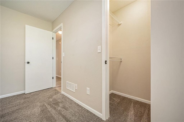 212 NW Parker Dr, Grain Valley, MO 64029 - unfurnished bedroom with carpet flooring and a spacious closet