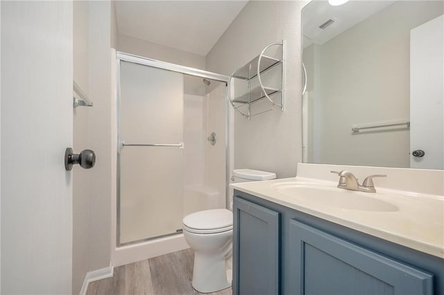 212 NW Parker Dr, Grain Valley, MO 64029 - full bath with a stall shower, vanity, and wood finished floors