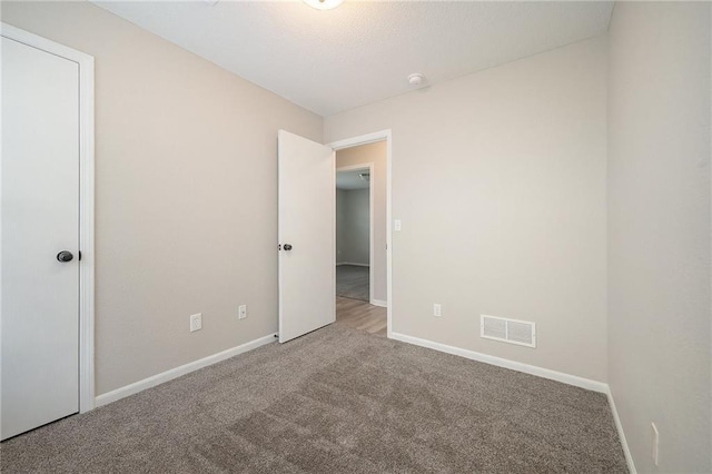212 NW Parker Dr, Grain Valley, MO 64029 - unfurnished bedroom with carpet floors and baseboards