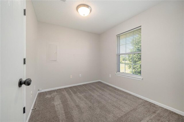 212 NW Parker Dr, Grain Valley, MO 64029 - carpeted empty room featuring baseboards and electric panel