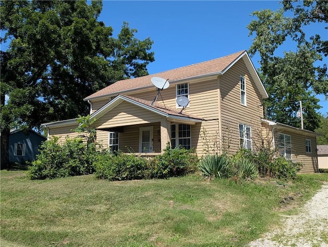 707 N 4th St, La Cygne, KS 66040 - view of front of property featuring a front yard