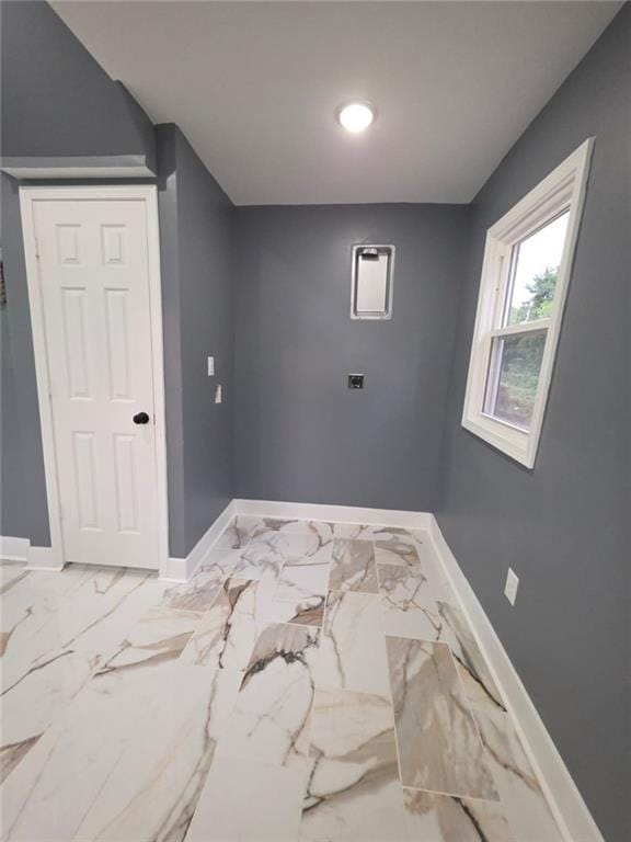 1027 Ohio Ave, Kansas City, KS 66102 - spare room featuring baseboards and marble finish floors