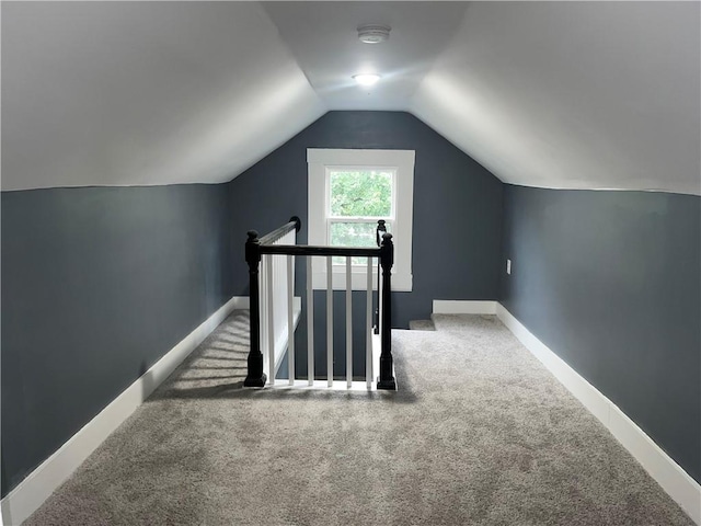 1027 Ohio Ave, Kansas City, KS 66102 - additional living space featuring carpet and vaulted ceiling