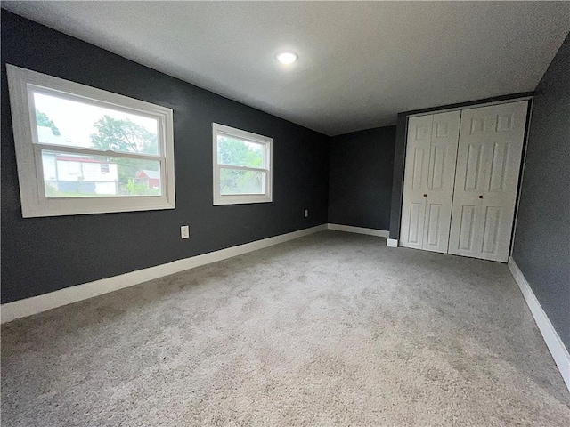 1027 Ohio Ave, Kansas City, KS 66102 - unfurnished bedroom with carpet floors, a closet, and recessed lighting