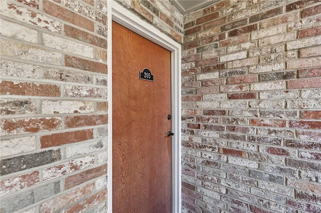 5006 Baltimore Ave Unit 205, Kansas City, MO 64112 - property entrance with brick siding