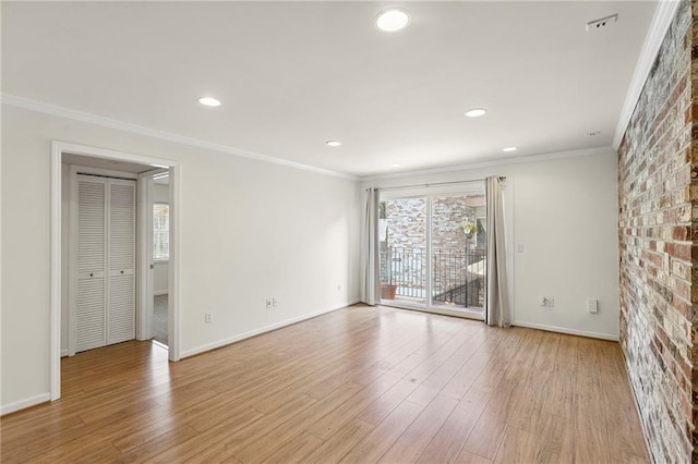 5006 Baltimore Ave Unit 205, Kansas City, MO 64112 - unfurnished room featuring light wood-type flooring, crown molding, and recessed lighting