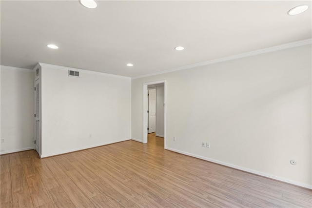 5006 Baltimore Ave Unit 205, Kansas City, MO 64112 - spare room featuring ornamental molding, recessed lighting, and light wood-style floors