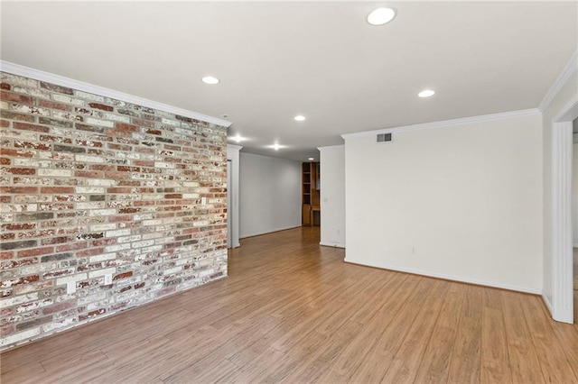 5006 Baltimore Ave Unit 205, Kansas City, MO 64112 - spare room with ornamental molding, wood finished floors, and recessed lighting
