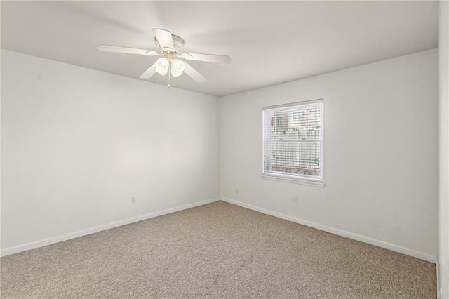 5006 Baltimore Ave Unit 205, Kansas City, MO 64112 - spare room featuring carpet flooring and a ceiling fan