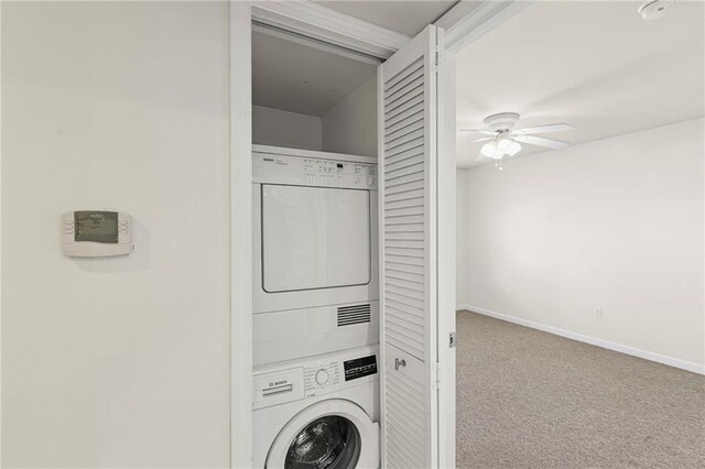 5006 Baltimore Ave Unit 205, Kansas City, MO 64112 - laundry room featuring stacked washer and clothes dryer, ceiling fan, and carpet flooring