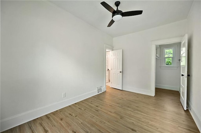 3808 Anderson Ave, Kansas City, MO 64123 - unfurnished bedroom featuring light wood finished floors and ceiling fan
