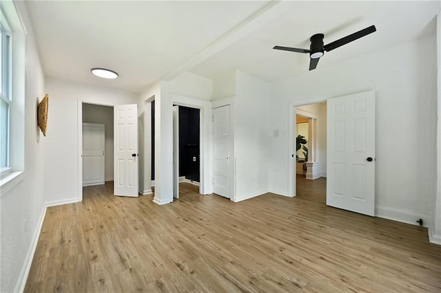 3808 Anderson Ave, Kansas City, MO 64123 - unfurnished bedroom with light wood-type flooring, multiple closets, and a ceiling fan