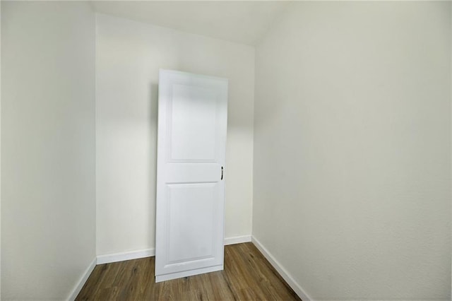 3808 Anderson Ave, Kansas City, MO 64123 - unfurnished room with dark wood-style floors