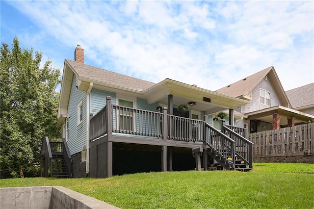 3808 Anderson Ave, Kansas City, MO 64123 - rear view of house with stairway and a chimney