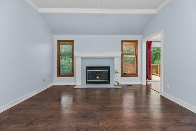 1401 NE Weddle Ln, Lees Summit, MO 64086 - unfurnished living room featuring vaulted ceiling, plenty of natural light, a tile fireplace, wood finished floors, and ornamental molding