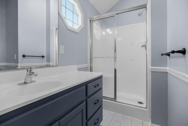 1401 NE Weddle Ln, Lees Summit, MO 64086 - bathroom featuring a stall shower, vanity, and lofted ceiling