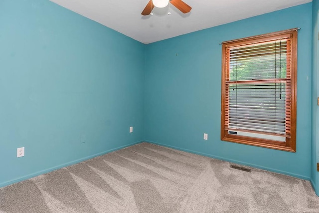 1401 NE Weddle Ln, Lees Summit, MO 64086 - spare room with a ceiling fan and carpet