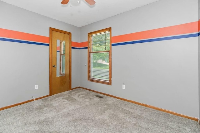 1401 NE Weddle Ln, Lees Summit, MO 64086 - carpeted spare room featuring a ceiling fan and baseboards