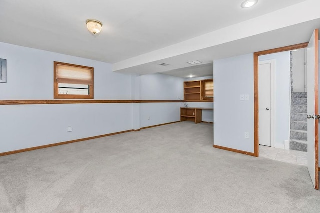 1401 NE Weddle Ln, Lees Summit, MO 64086 - unfurnished living room featuring light colored carpet and baseboards