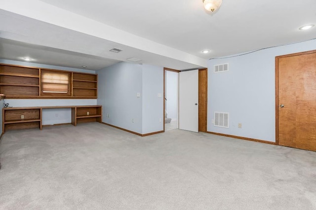 1401 NE Weddle Ln, Lees Summit, MO 64086 - unfurnished office featuring light colored carpet, built in desk, and recessed lighting
