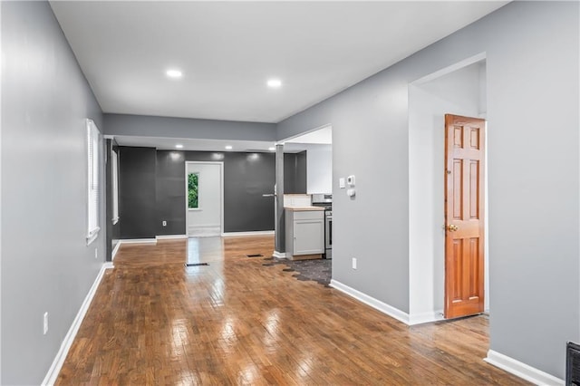 600 Ridgeview Ave, Kansas City, KS 66103 - unfurnished living room featuring hardwood / wood-style floors and recessed lighting