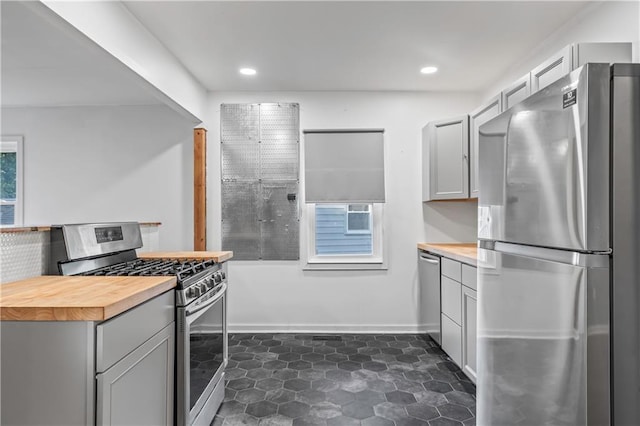 600 Ridgeview Ave, Kansas City, KS 66103 - kitchen with stainless steel appliances, butcher block countertops, gray cabinets, and recessed lighting