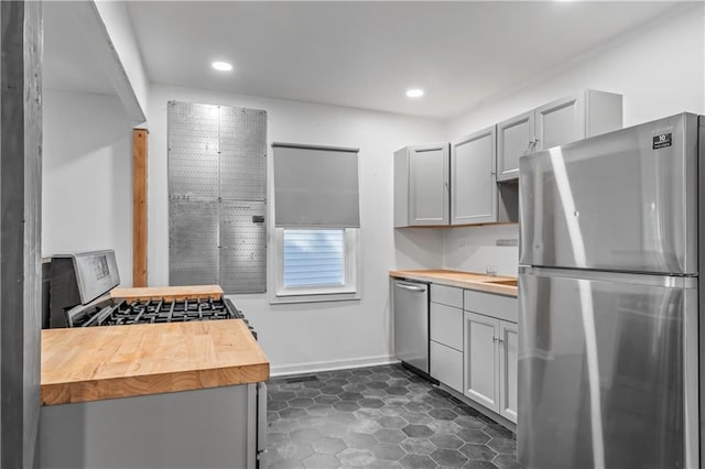 600 Ridgeview Ave, Kansas City, KS 66103 - kitchen featuring stainless steel appliances, wood counters, gray cabinetry, and recessed lighting