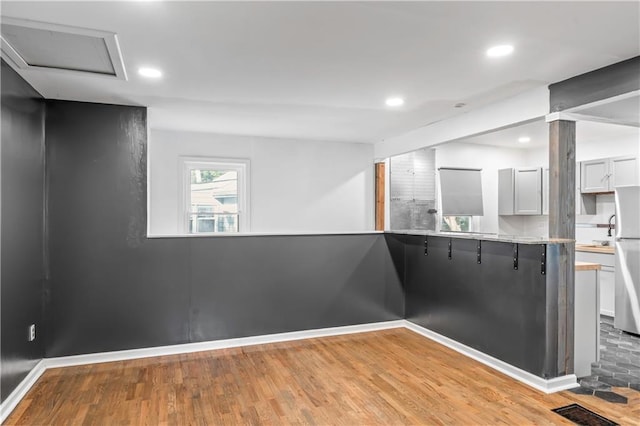 600 Ridgeview Ave, Kansas City, KS 66103 - unfurnished dining area featuring light wood-style floors and recessed lighting