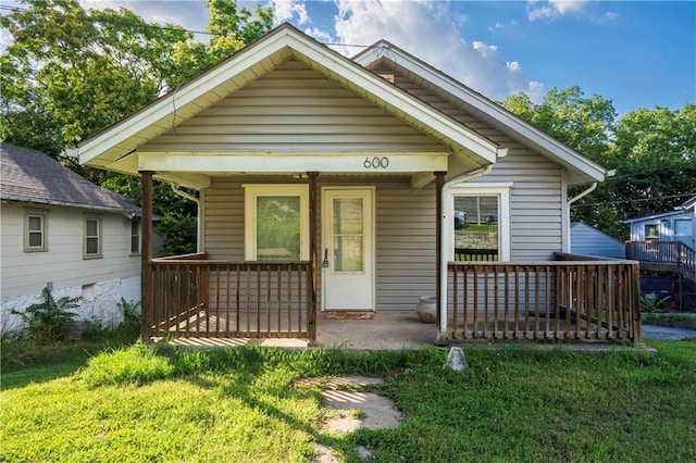 600 Ridgeview Ave, Kansas City, KS 66103 - view of front of house featuring covered porch and a front yard
