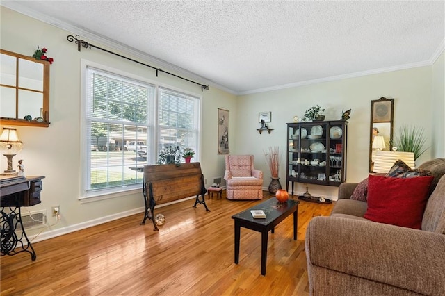 7211 Goodman St, Overland Park, KS 66204 - living room featuring crown molding, a textured ceiling, and light wood finished floors