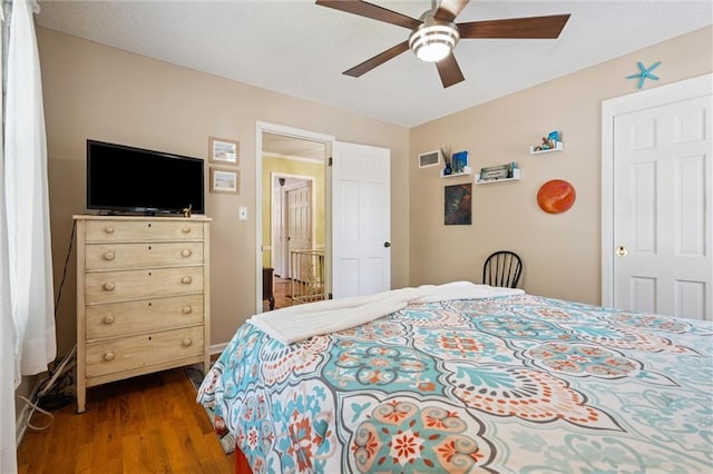 7211 Goodman St, Overland Park, KS 66204 - bedroom with dark wood-style floors and a ceiling fan