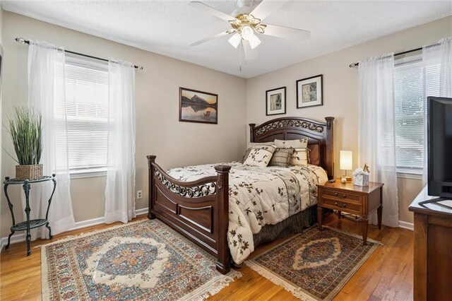 7211 Goodman St, Overland Park, KS 66204 - bedroom featuring wood finished floors and a ceiling fan