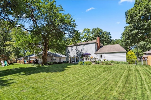 7211 Goodman St, Overland Park, KS 66204 - view of yard with a playground and a wooden deck