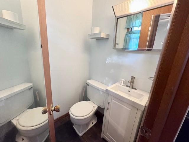 1012 Meadowbrook Rd E, Iola, KS 66749 - bathroom with vanity and wood finished floors
