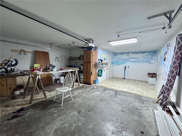 1012 Meadowbrook Rd E, Iola, KS 66749 - garage featuring a workshop area and a garage door opener