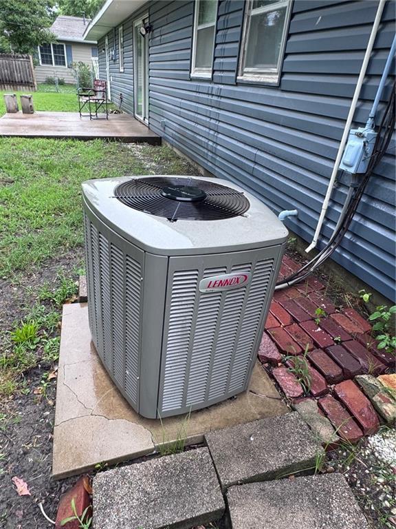 1012 Meadowbrook Rd E, Iola, KS 66749 - exterior view of a central AC unit and a jacuzzi