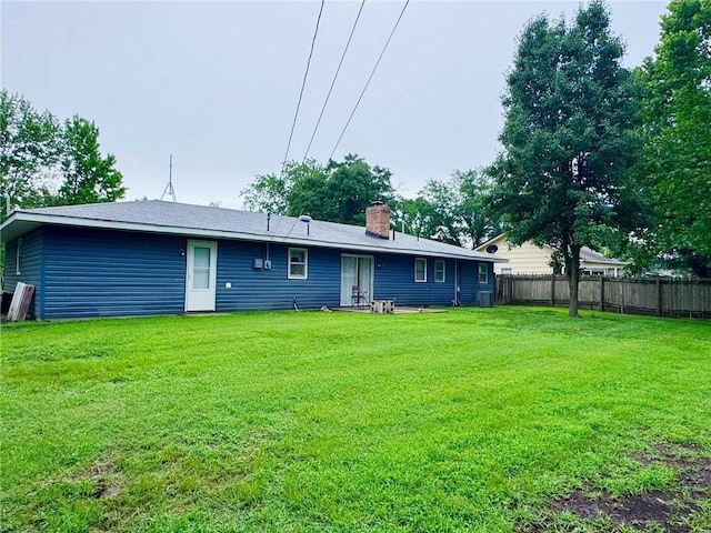 1012 Meadowbrook Rd E, Iola, KS 66749 - rear view of property featuring a chimney