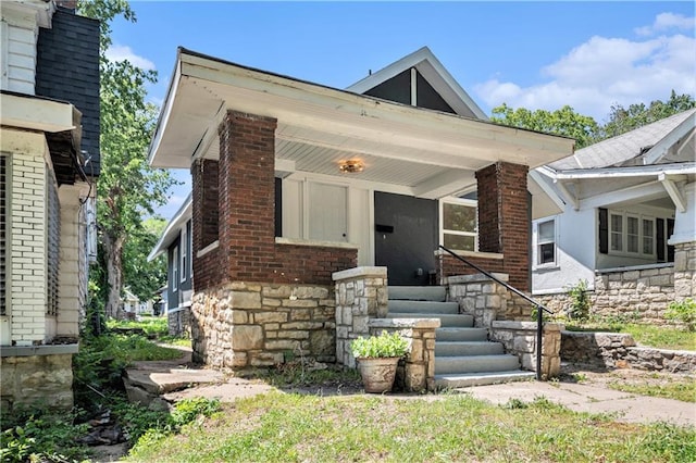 4036 Benton Blvd, Kansas City, MO 64130 - view of front of property with stone siding and a porch