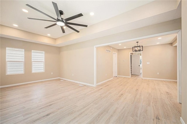 4036 Benton Blvd, Kansas City, MO 64130 - unfurnished room featuring light wood-style floors, ceiling fan, recessed lighting, and a chandelier