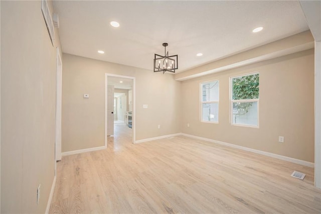 4036 Benton Blvd, Kansas City, MO 64130 - empty room with a chandelier, recessed lighting, and light wood-type flooring