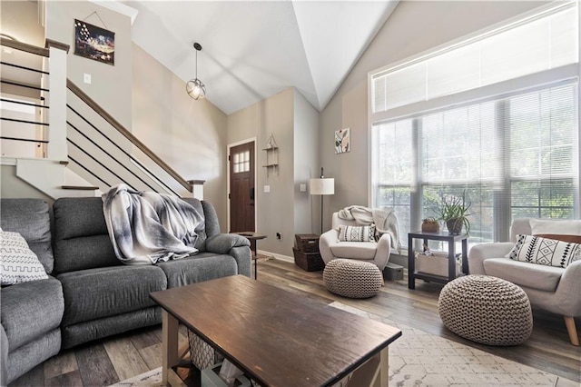 109 NW Whitlock Dr, Lees Summit, MO 64081 - living area with wood finished floors, stairs, and high vaulted ceiling