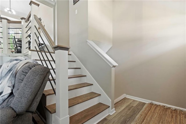 109 NW Whitlock Dr, Lees Summit, MO 64081 - stairs featuring wood finished floors and baseboards