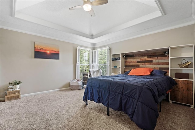 109 NW Whitlock Dr, Lees Summit, MO 64081 - carpeted bedroom with a raised ceiling, ornamental molding, and a ceiling fan